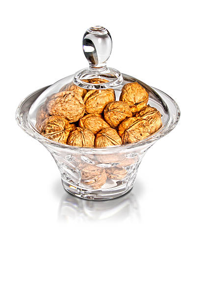 istock Nutmegs in glass jar on white background 177261832