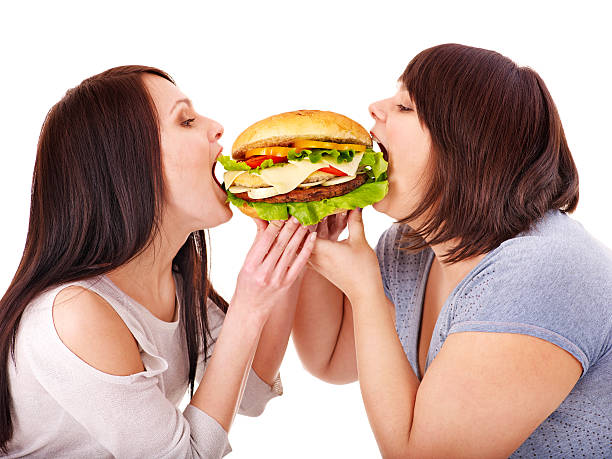 istock Women eating hamburger. 177261845