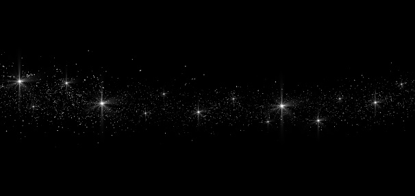 Glittering stardust trail on black background