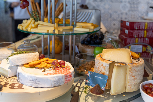 Fresh French and Italian cheeses on buffet
