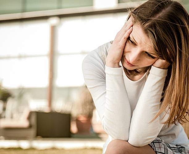 istock Young woman with headache outdoor 177262539