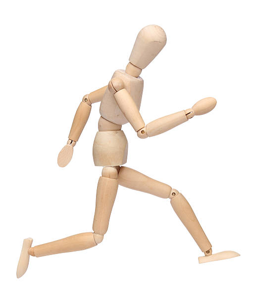 istock wood mannequin running over white 177262789