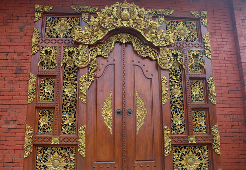 carved door in front of the recreation area