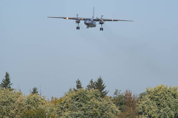 Ukrainian Armed Forces Antonov An-26 landing Antonov An-26 military transport aircraft of Ukrainian Armed Forces landing at Lviv antonov an 26 stock pictures, royalty-free photos & images