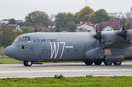 US Air Force Lockheed C-130 Hercules military aircraft taxiing after landing in Lviv. Close-up photo