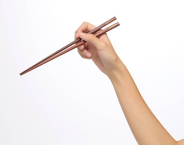 a forma correcta realização de hashis - chopsticks human hand women isolated - fotografias e filmes do acervo