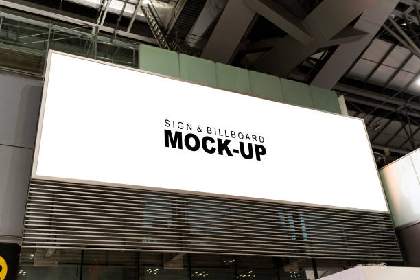 Large Blank Billboard in Airport Terminal large blank billboard in an airport terminal. The billboard is perfect for displaying your advertising or promotional message to a large audience of travelers. retail digital signage stock pictures, royalty-free photos & images