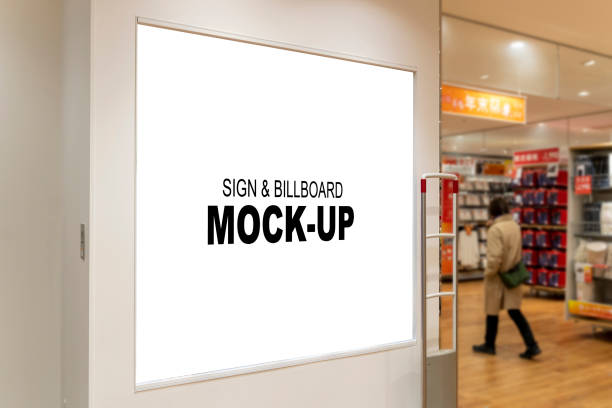 Blank Square Billboard Mockup A blank square billboard mockup at the front door of a shop. This photo is perfect for designers and businesses who want to showcase their designs or promote their products or services in a professional and realistic way. retail digital signage stock pictures, royalty-free photos & images