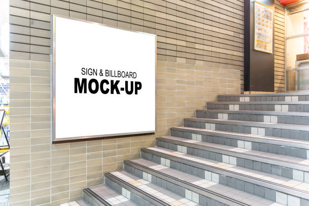 Blank Square Billboard Mockup A blank square billboard mockup at the front door of a shop. This photo is perfect for designers and businesses who want to showcase their designs or promote their products or services in a professional and realistic way. retail digital signage stock pictures, royalty-free photos & images