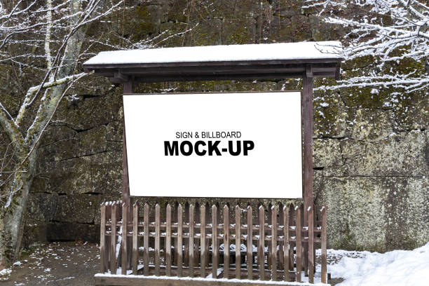 istock Wooden sign mock-up in a snow-covered park. 1772643472