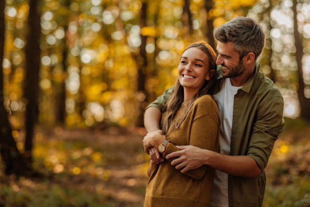 istock Happy couple hugging in the woods 1772643534