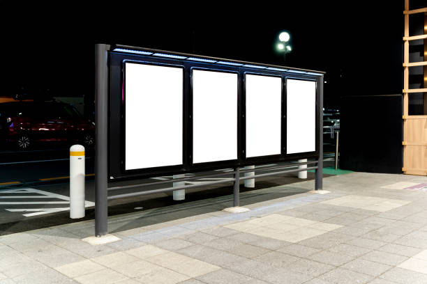 istock Row of blank vertical billboard on Sidewalk at Night 1772644124