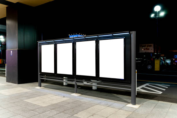 istock Row of blank vertical billboard on Sidewalk at Night 1772644147