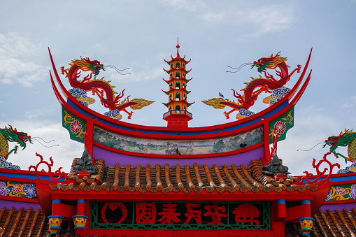 Chinese temple roof with dragons and pagoda. Ling San temple in Tuaran, Sabah, Malaysia.