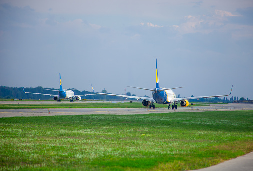 Ukrainian passenger plane AZURAIR Boeing 737-800 UR-AZO. Airport apron. Aircraft on runway. Airplane arrives. Ukraine, Kyiv - September 1, 2021.