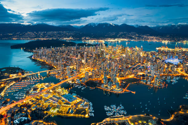 istock Vancouver Cityscape Nightscape surrounded by sea and mountains 1772660498