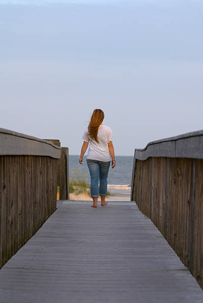 istock Girl Walking to the Beach 177266646