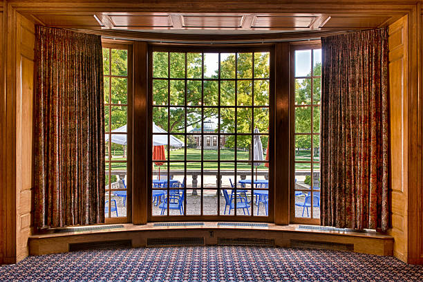 Auditorium framed by bay window The Foellinger Auditorium and Quad as viewed from the south lounge of the Illini Union on the campus of the University of Illinois in Urbana, Illinois bay window stock pictures, royalty-free photos & images