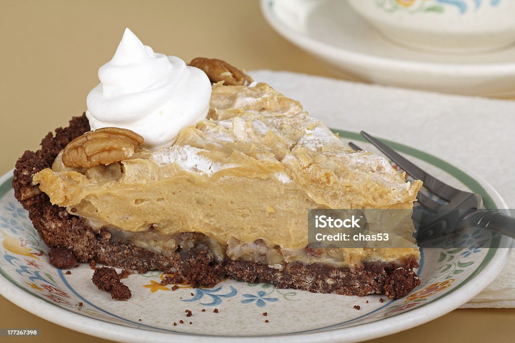 Peanut Butter Pie Slice Slice of peanut butter pie with whipped cream on a plate Baked Stock Photo