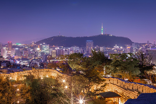 Cityscape of Seoul and skyscrapers in Dongdaemun area There is Namsan Mountain in the background, South Korea.