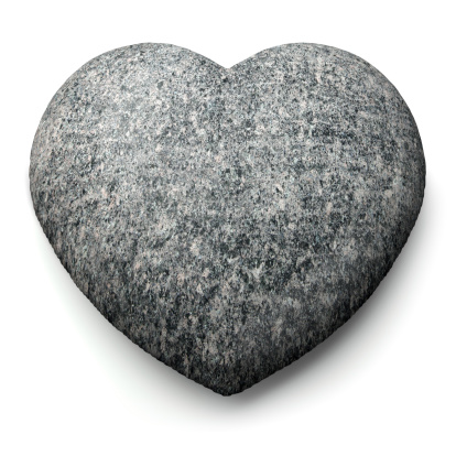 A piece of granite shaped like a heart on white background. Extremely high resolution and detailed