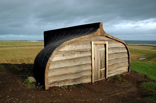 istock Unconventional Boat House on Beachside Fields Overlooking Sea 177268357