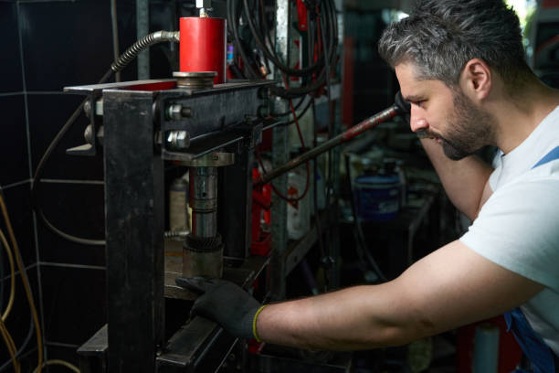 istock Skilled worker is repairing metal part using machine 1772689266