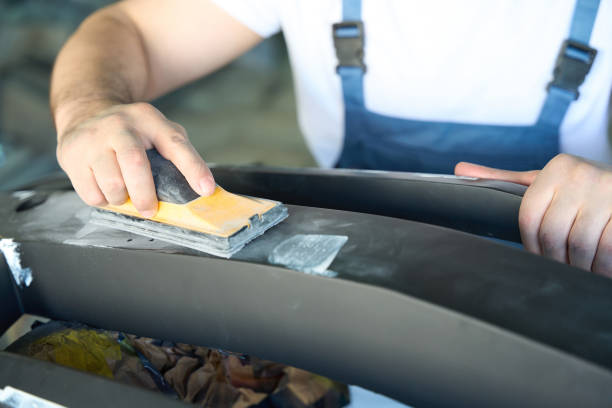 istock Service station worker polishing auto body part 1772689282