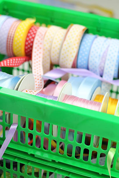 Colourful ribbons placed in a tray stock photo