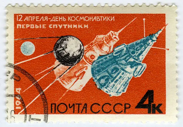 "Postage stamps printed in USSR shows Soviet sputnik, circa 1964"