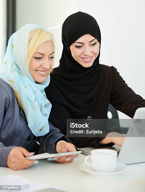 Two Women Having A Business Meeting In An Office Stock Photo - Download Image Now - Adult, Adults Only, Arabia