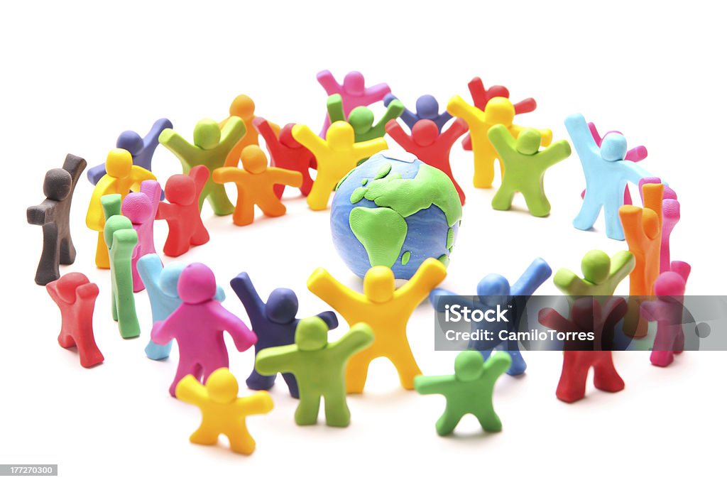 we are the world colorful group of plasticine people arranging a circle around planet earth Child's Play Clay Stock Photo