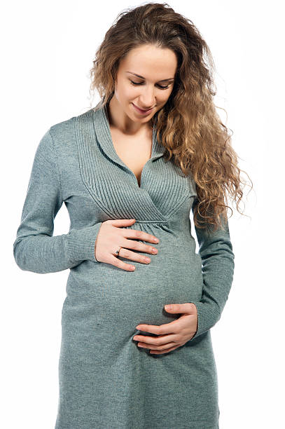 istock pregnant woman caressing her belly 177270421