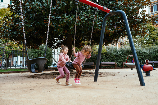 Girls playing in the park and playground