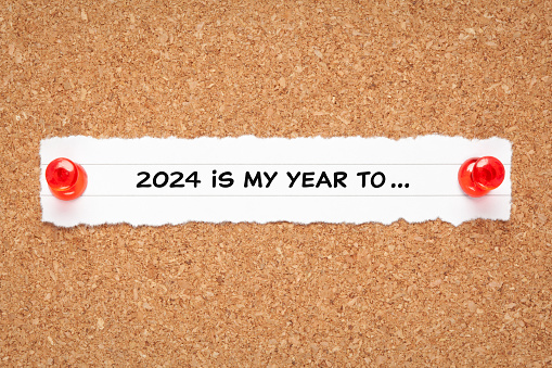 Motivational New Year 2024 resolutions list concept with headline 2024 is my year to written on a piece of paper.