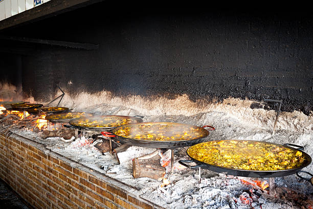 istock Valencian paella cooking on log fire 177271118