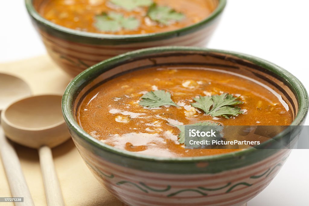 Moroccan harira soup Moroccan harira soup served in traditional bowls and wooden spoons Moroccan Culture Stock Photo