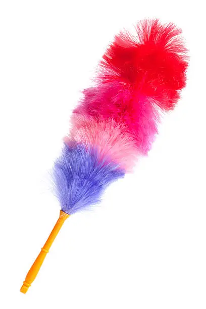 Soft colorful duster with plastic handle on a white background