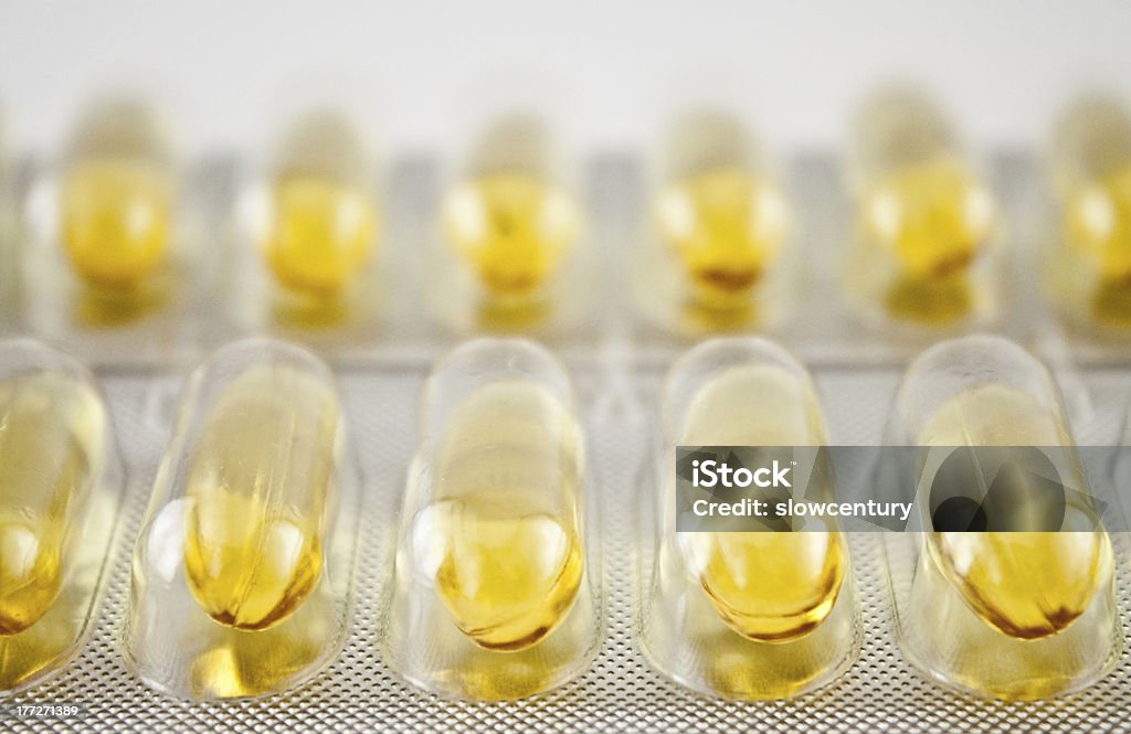 Giallo pillole di gel - Foto stock royalty-free di Alimentazione sana