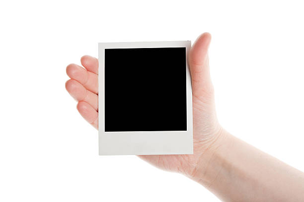 istock One instant photo in hand 177271479