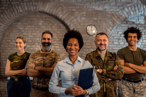 istock Portrait of smiling diverse veterans at PTSD support group. 1772719201