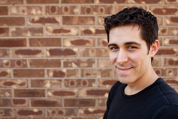 istock Man In Front of Brick Wall 177271956
