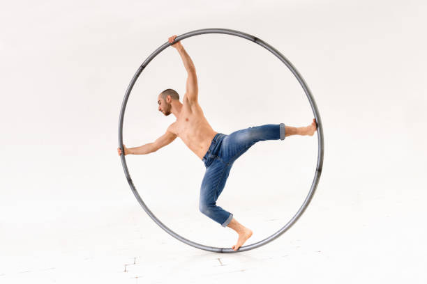 istock Man performing trick on cyr wheel 1772720348