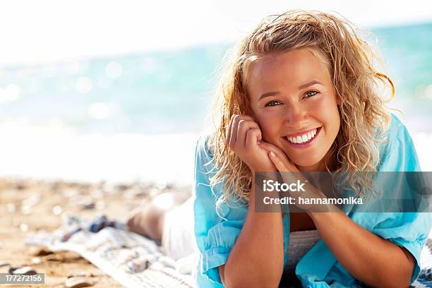 A Young Woman Smiling On The Beach Stock Photo - Download Image Now - Adult, Adults Only, Aspirations