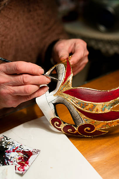 Making of venice carnival mask "Woman hands with venice carnival mask, painting, making of mask decoration" painted masquerade masks stock pictures, royalty-free photos & images