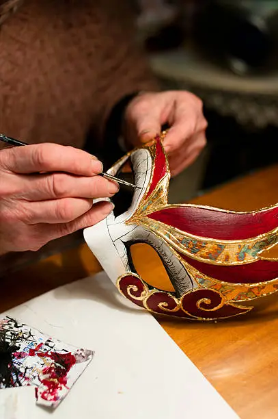 "Woman hands with venice carnival mask, painting, making of mask decoration"
