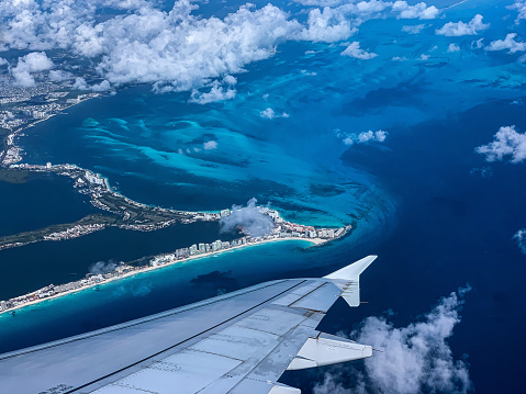 Flying over the tropical Caribbean coastline of Cancun, Mexico.