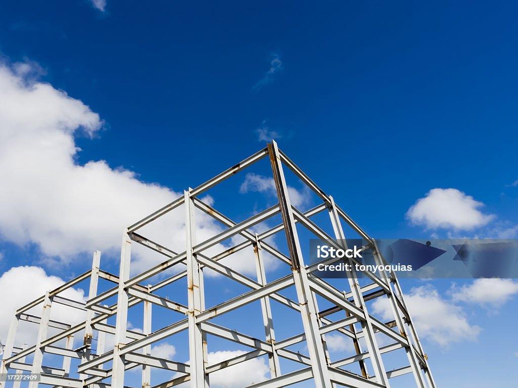 Construction Trusses of a building construction shot against blue sky Blue Stock Photo