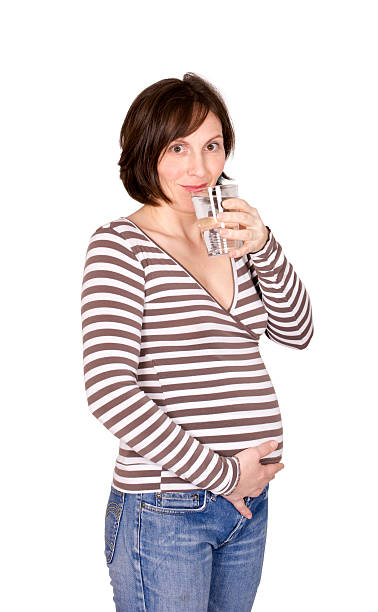 istock Pregnant woman drinking water. 177273533