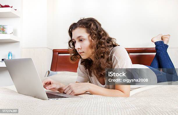 Teenage Girl Using A Computer Stock Photo - Download Image Now - Apartment, Beautiful People, Beauty